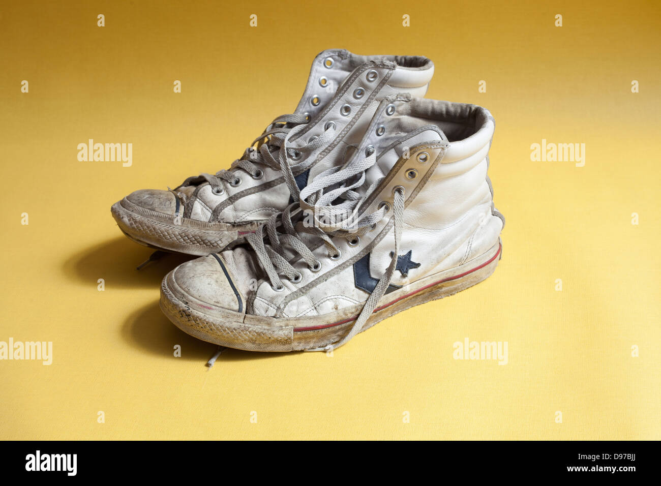 An old pair of white Converse boots Stock Photo - Alamy