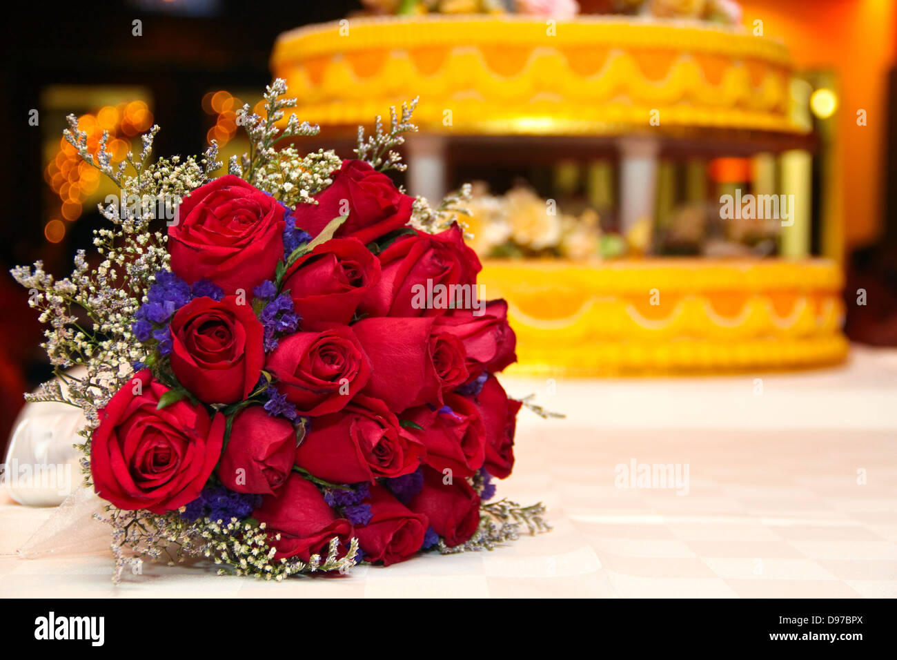 A hand bouquet of red roses in a table top setup Stock Photo Alamy