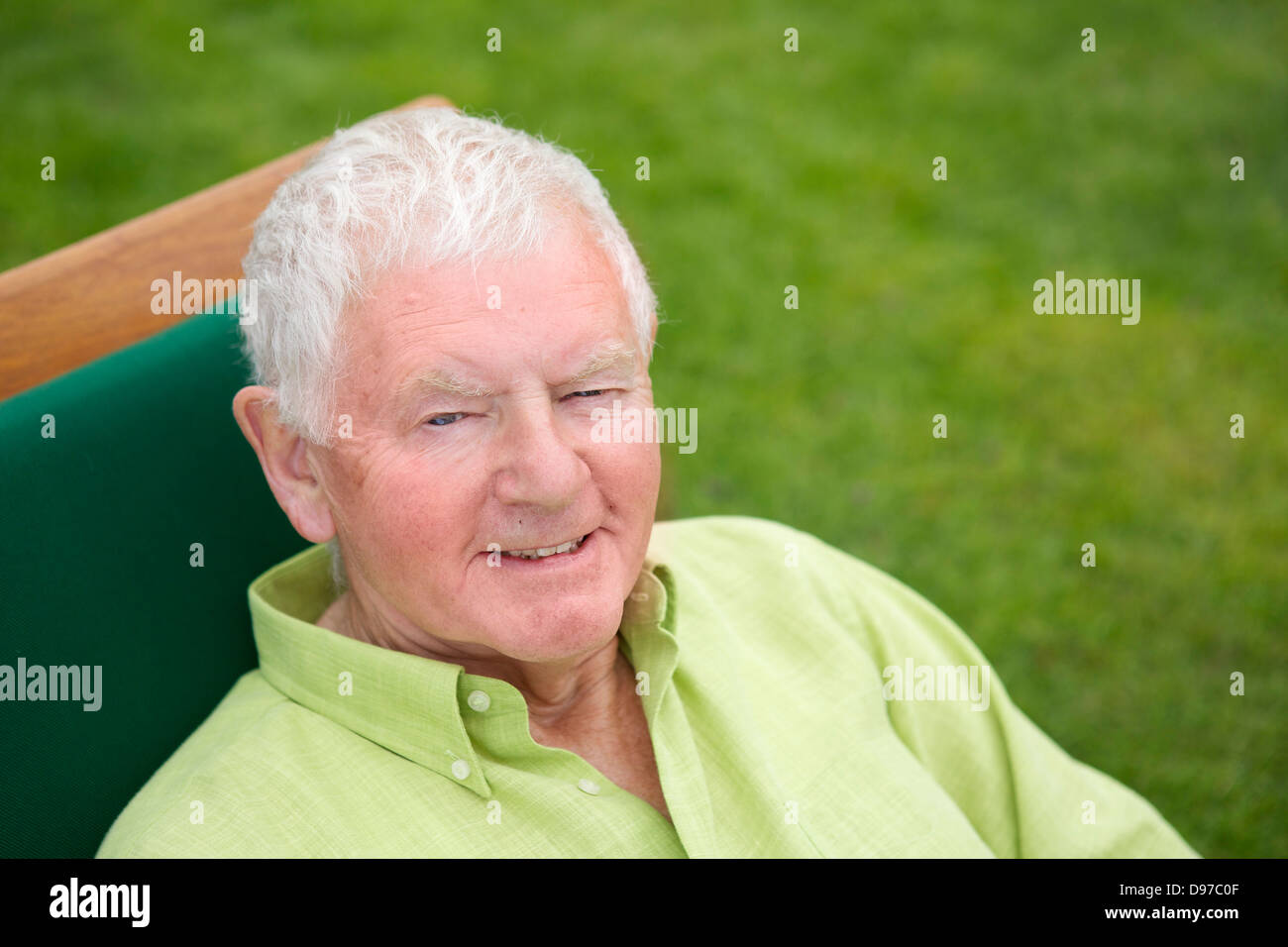 Seventies Man Active Retirement Lifestyle Reclining Smiling Stock Photo