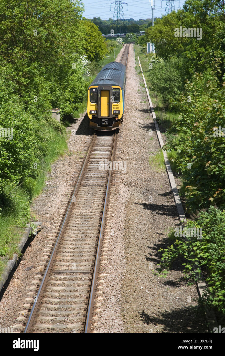 Diesel train on the East Suffolk railway line between Lowestoft and Ipswich, Suffolk, England Stock Photo
