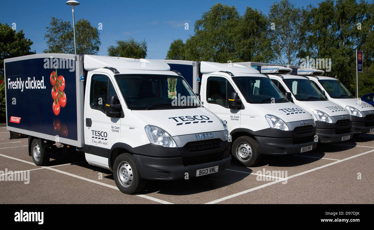 Parked Tesco home delivery vehicles advertised as offering a 'freshly clicked' service, UK Stock Photo