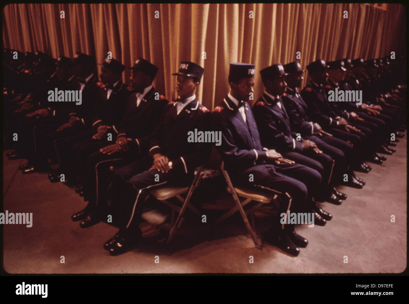 'The Fruit Of Islam', A Special Group Of Bodyguards For Muslim Leader Elijah Muhammad, Sit At The Bottom Of The Platform While H Stock Photo