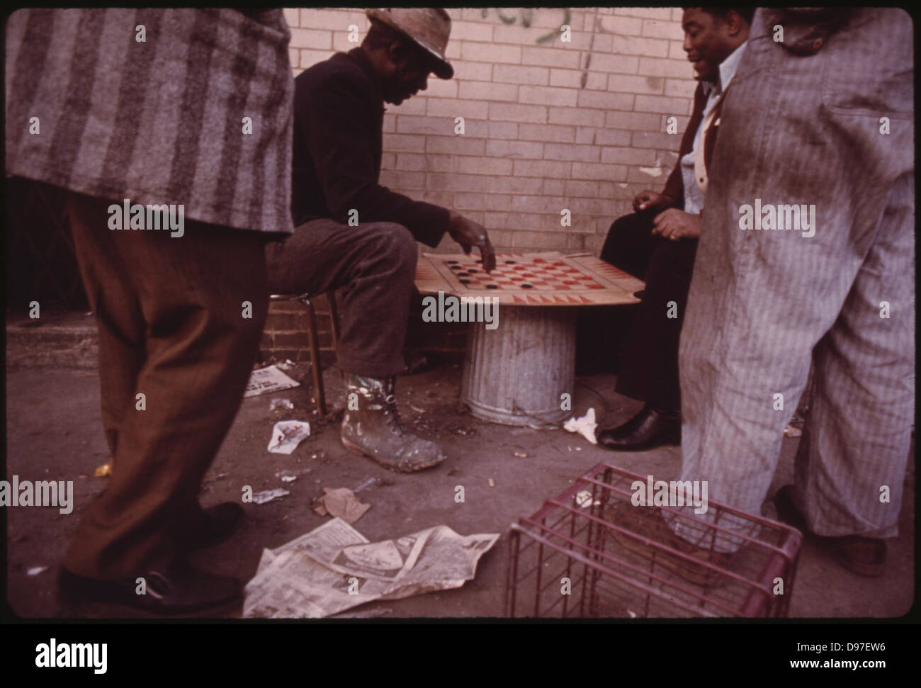 South Side Black Workers Passing The Time Playing Checkers On East 35th Street Before Going To Work In Chicago, 05/1973 Stock Photo