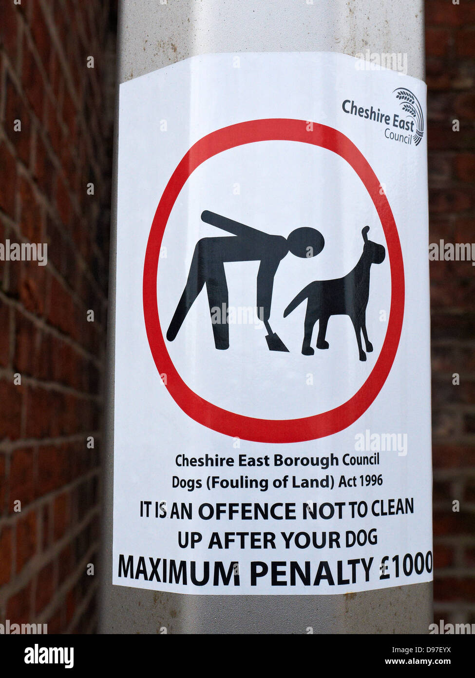 Warning sign for cleaning up after your dog Stock Photo