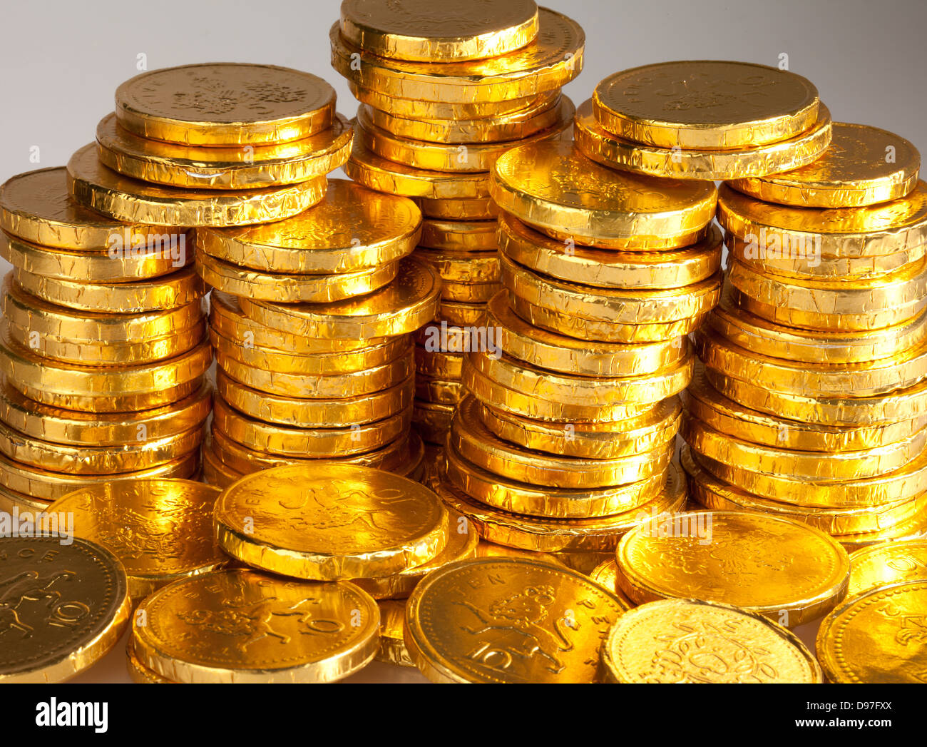 A stack of chocolate coins wrapped in a golden foil Stock Photo 57329186 Alamy