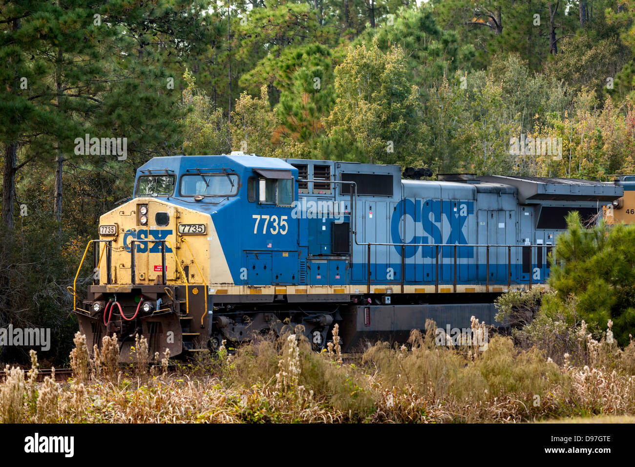CSX engine 7735 pulls a freight train through a rural area near Hawthorne, Florida. Stock Photo