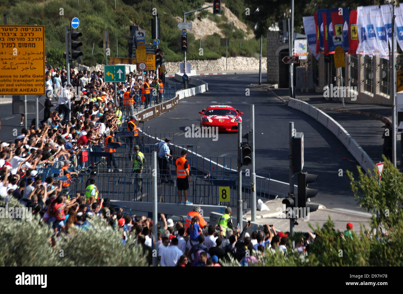 June 13, 2013 - Jerusalem, West Bank, Palestinian Territory - A Formula One racing car is driven during the race of the 'Peace Road Show' in Jerusalem's old city on June 13, 2013. Jerusalem's Sports Federations Group asserted that the race in Jerusalem with the participation of the Ferrari World team comes within the framework of the Judaization plans implemented by the Israeli Authorities in the city of Jerusalem  (Credit Image: © Saeed Qaq/APA Images/ZUMAPRESS.com) Stock Photo