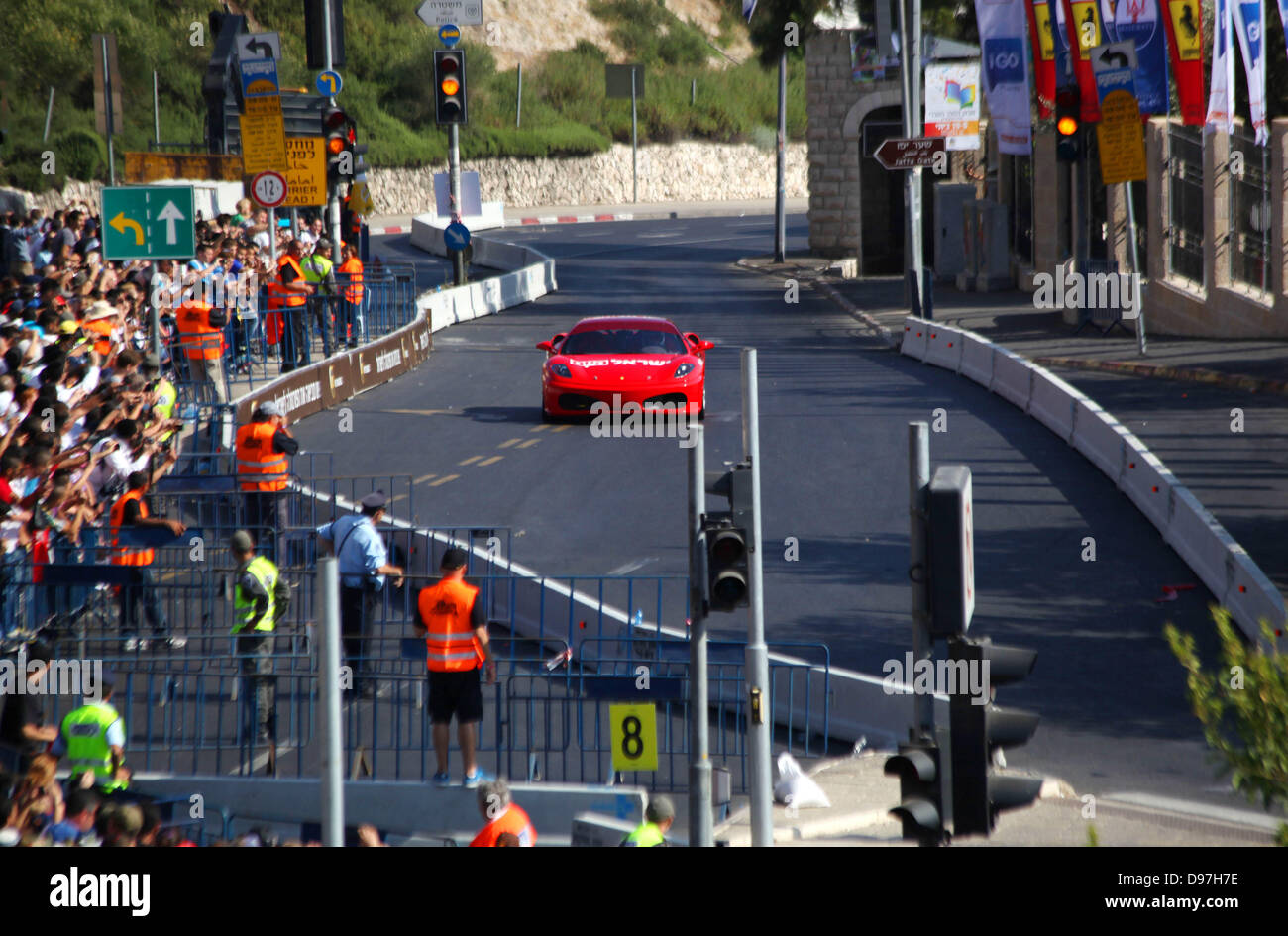 June 13, 2013 - Jerusalem, West Bank, Palestinian Territory - A Formula One racing car is driven during the race of the 'Peace Road Show' in Jerusalem's old city on June 13, 2013. Jerusalem's Sports Federations Group asserted that the race in Jerusalem with the participation of the Ferrari World team comes within the framework of the Judaization plans implemented by the Israeli Authorities in the city of Jerusalem  (Credit Image: © Saeed Qaq/APA Images/ZUMAPRESS.com) Stock Photo