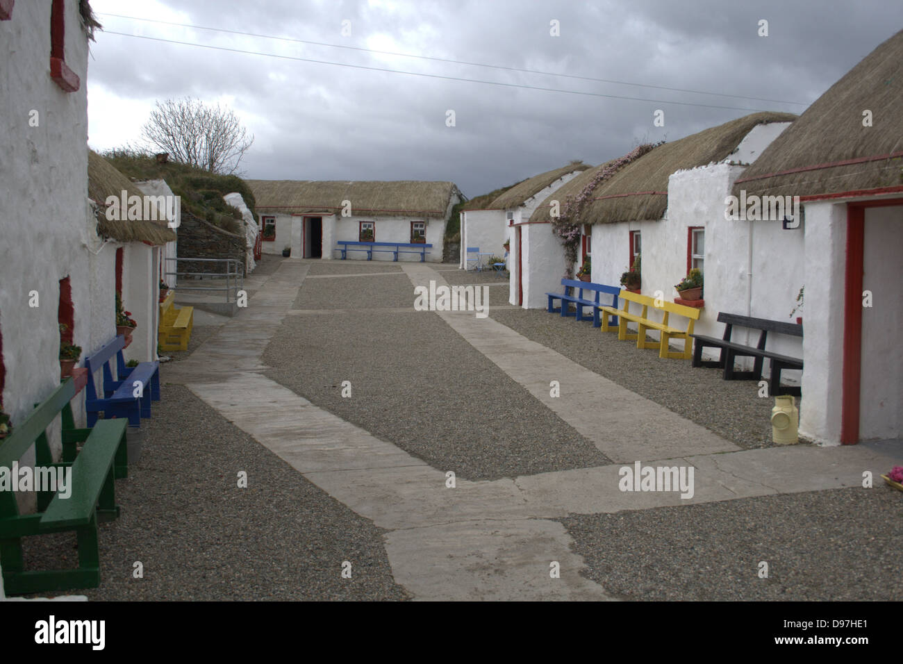Portrait of the main street lined with crofters, thatched cottages at Doagh Famine Village in Donegal, Ireland. Stock Photo