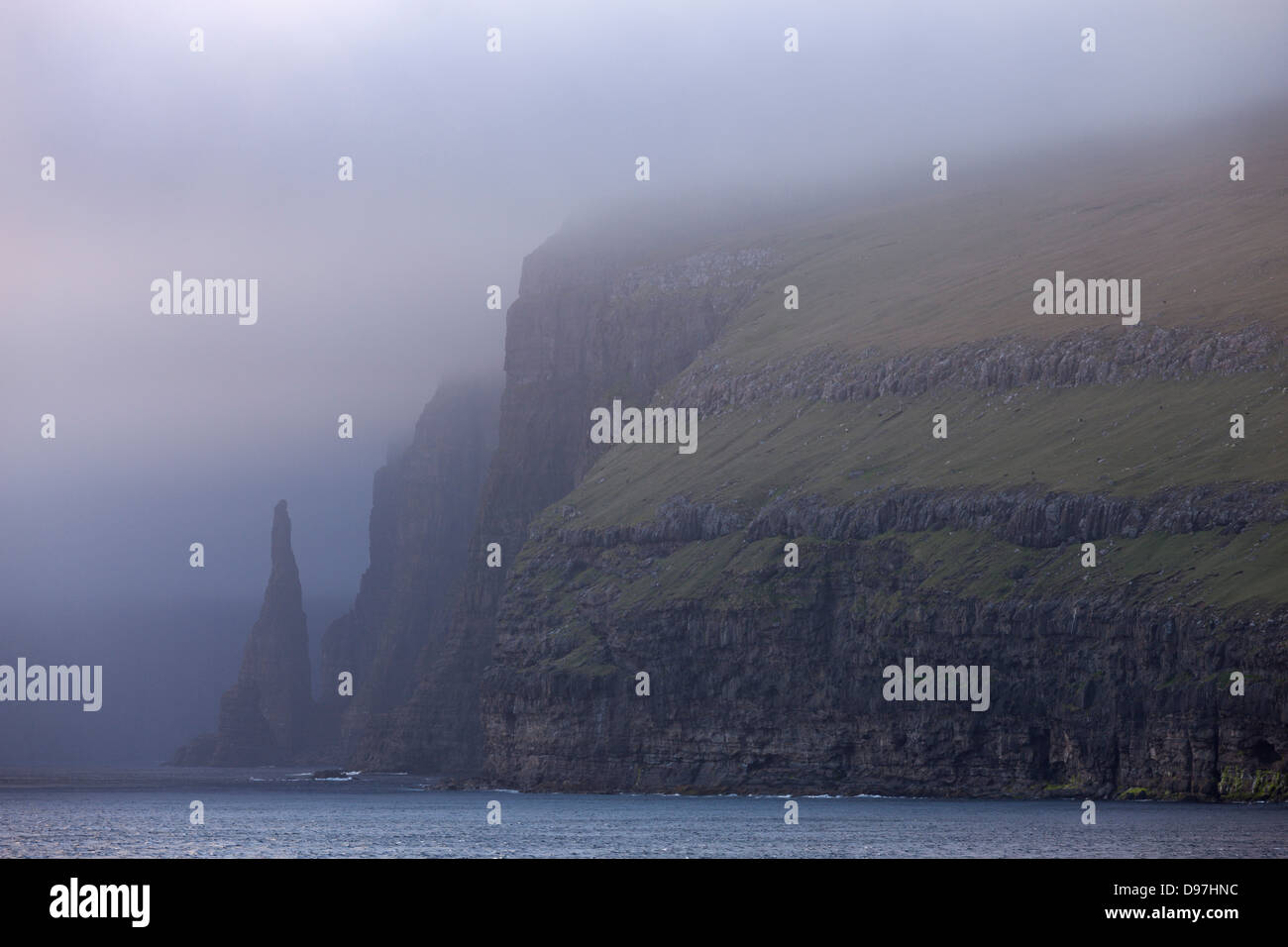 Towering cliffs and sea stacks on the west coast of Sandoy, Faroe Islands, Europe. Summer (June) 2012. Stock Photo