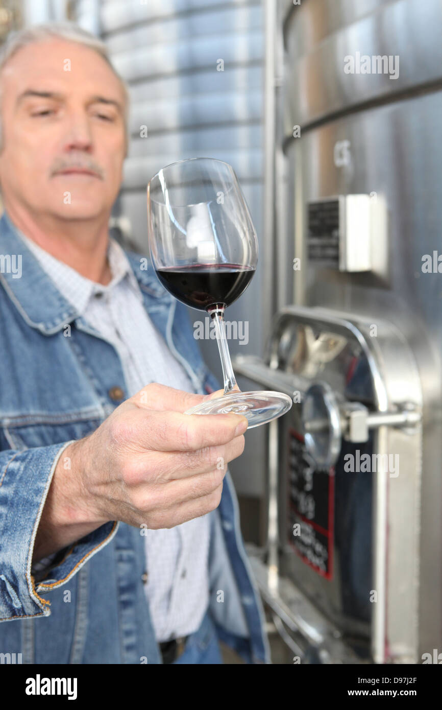 Winemaker with a glass of wine Stock Photo