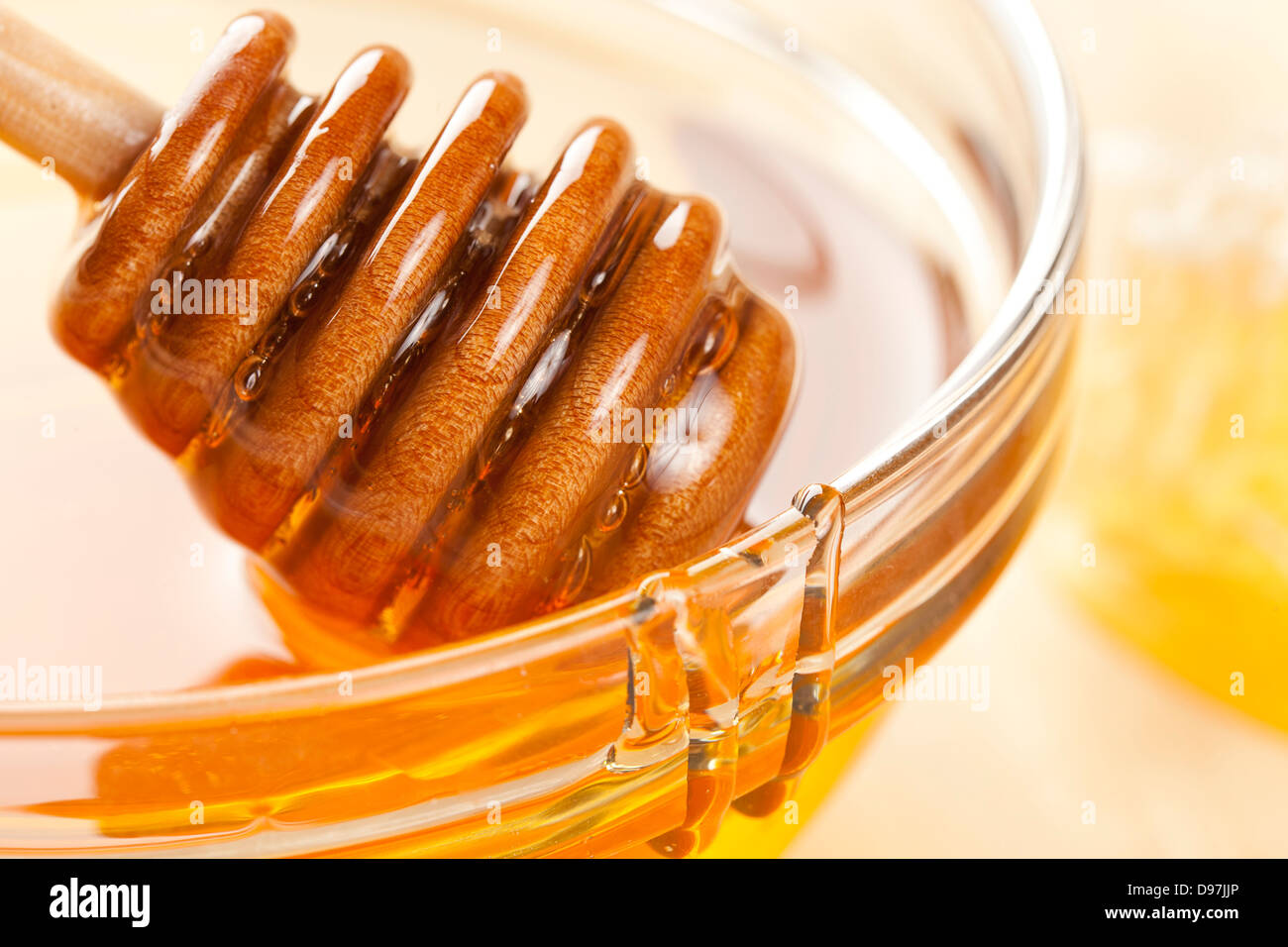 Golden Organic Honey against a back ground Stock Photo