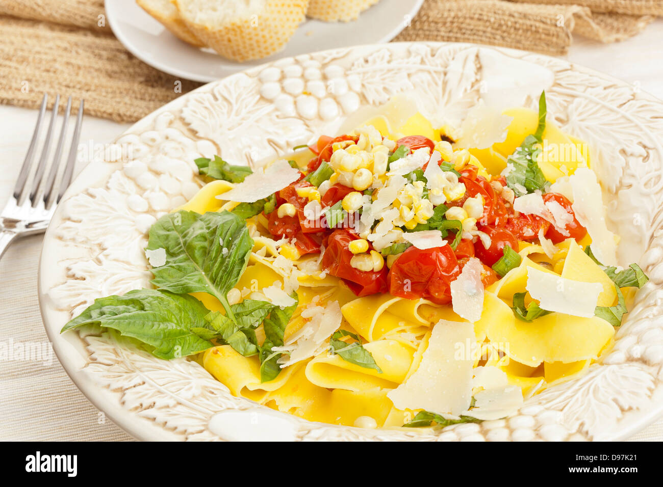 https://c8.alamy.com/comp/D97K21/homemade-pappardelle-pasta-with-corn-and-tomatoes-D97K21.jpg