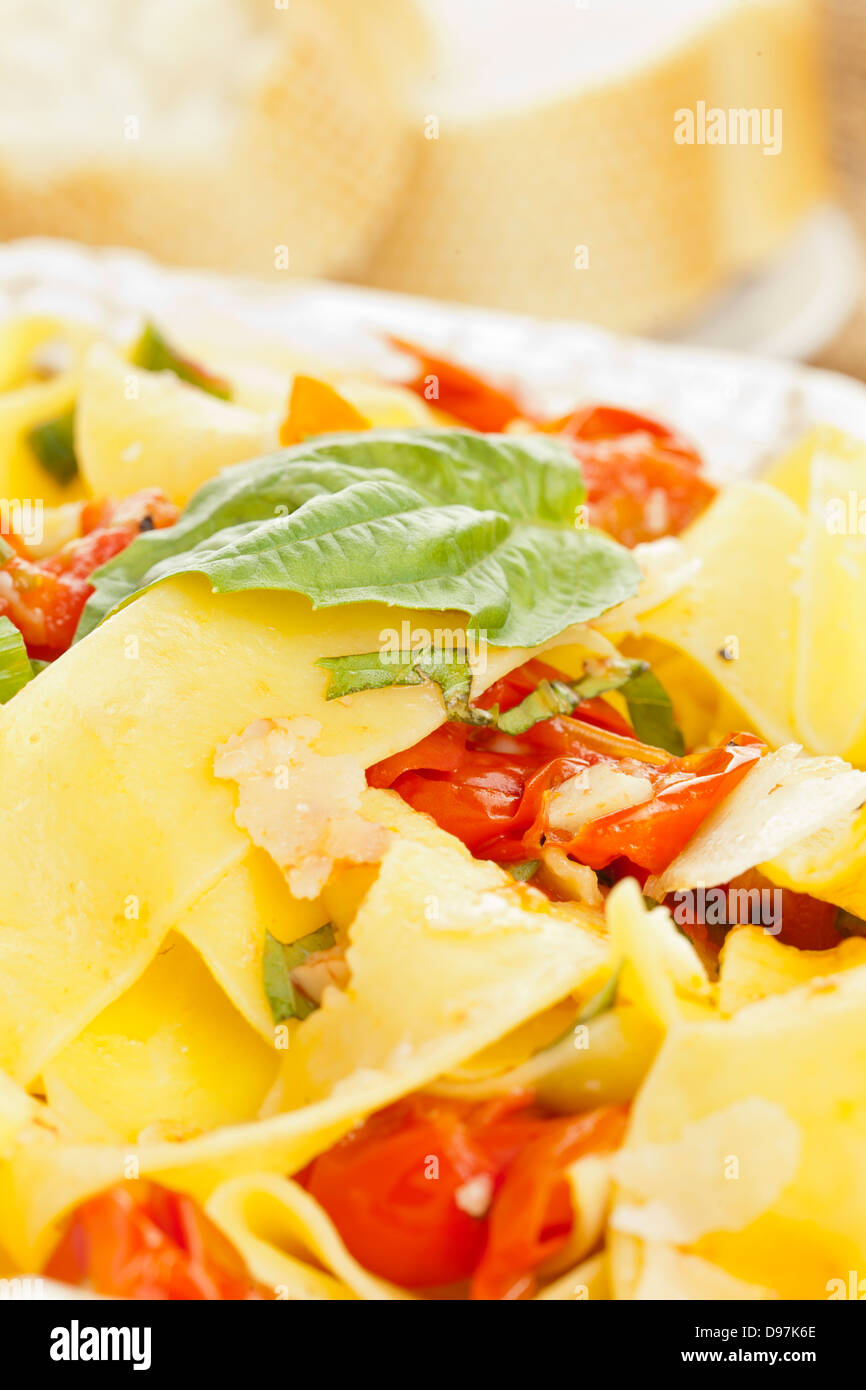 Homemade Pappardelle Pasta with corn and tomatoes Stock Photo