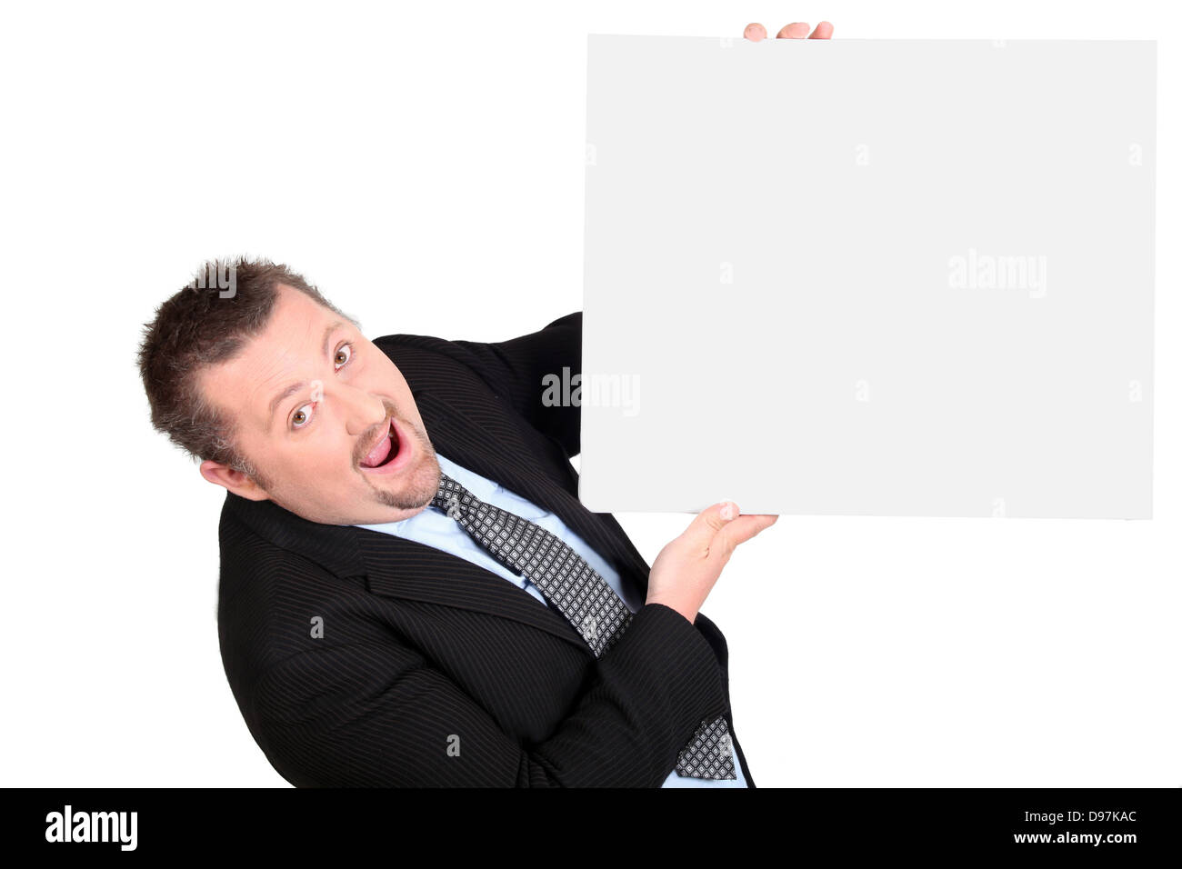 Astounded businessman with a blank board Stock Photo