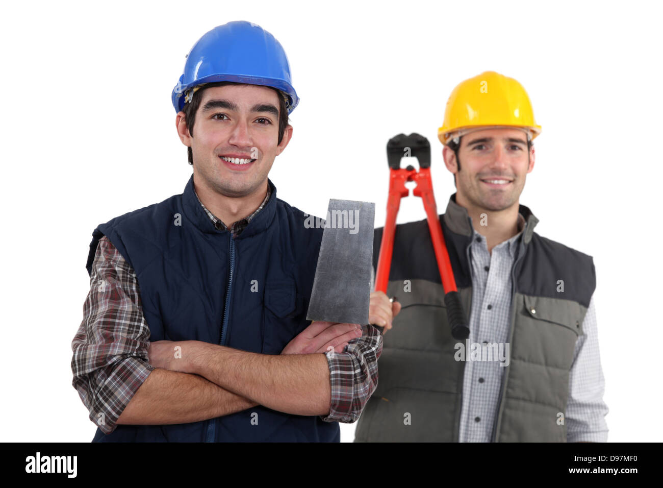 duo of craftsmen holding tools Stock Photo Alamy