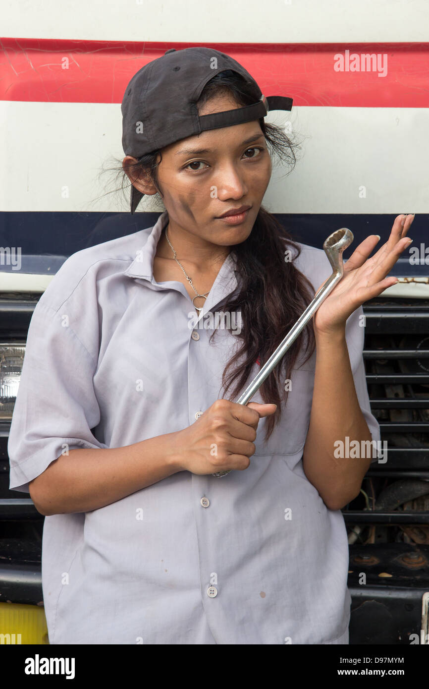 servicewoman stands in front of truck Stock Photo