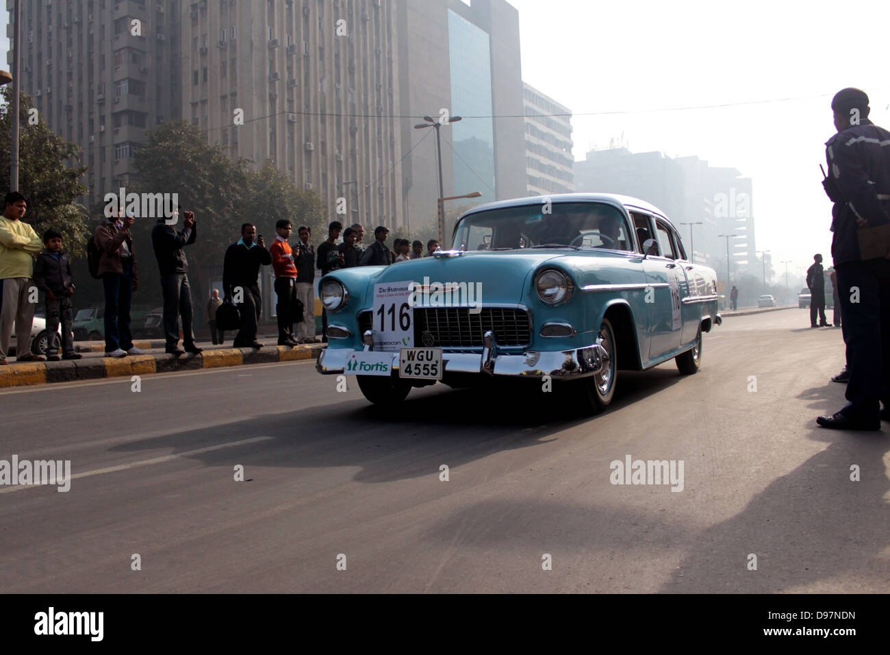 Crowds watch a participating car at the Statesman Vintage and Classic ...