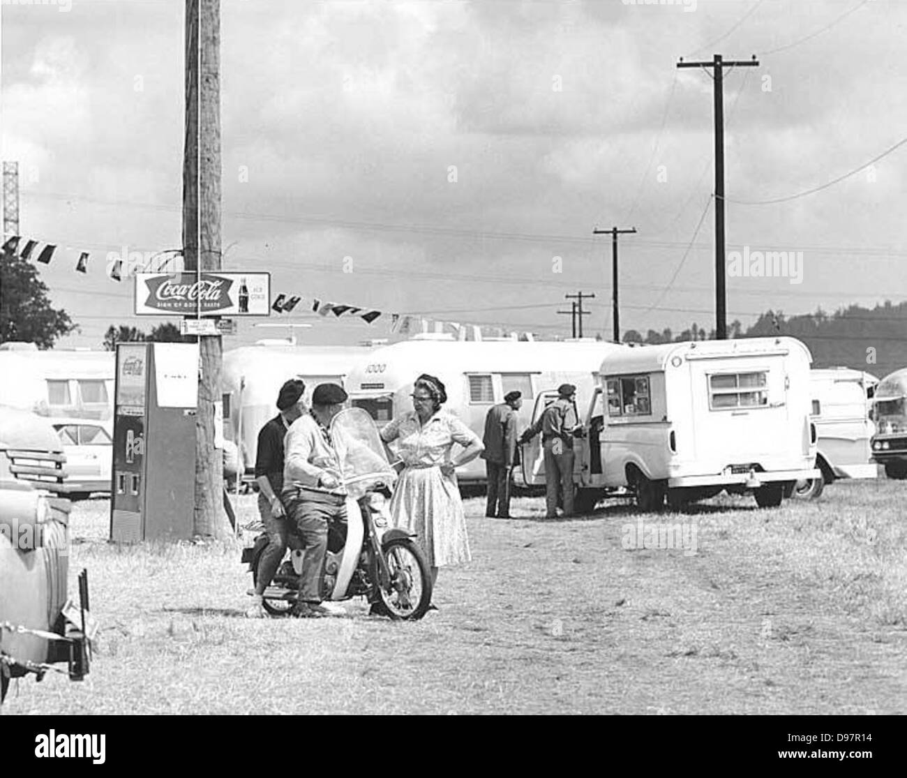 People, trailers and Coca-Cola machine at Airstream Rally Stock Photo
