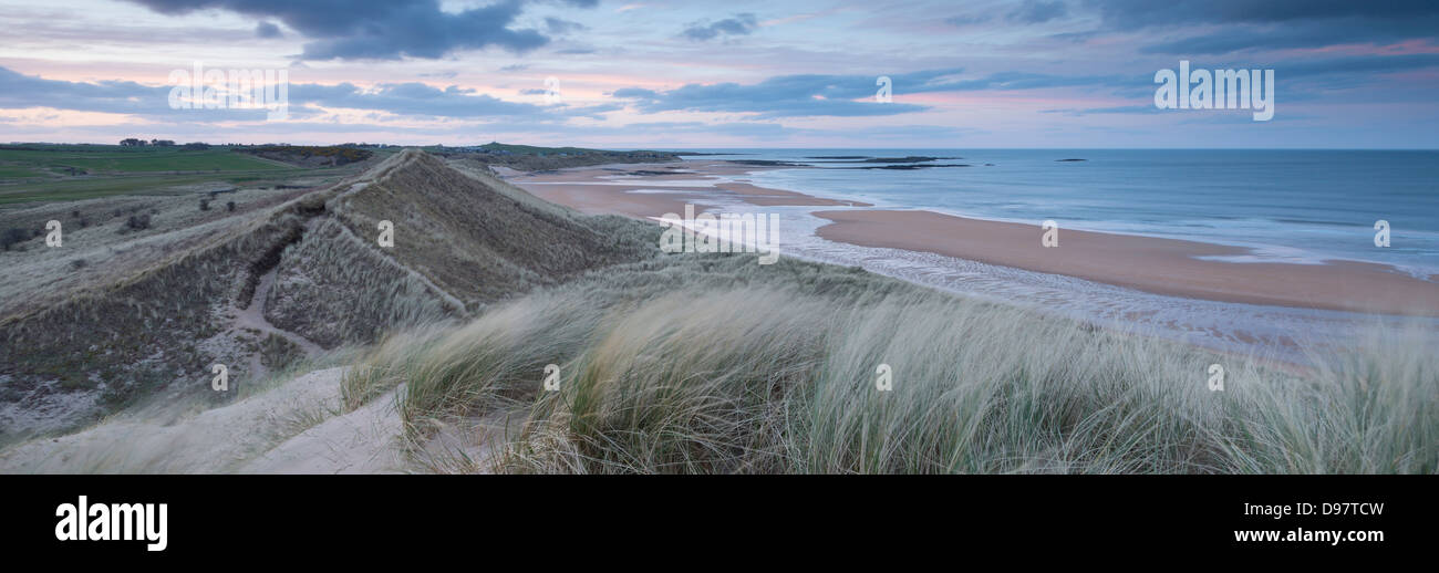 Twilight over Embleton Bay, viewed from the sand dunes, Northumberland, England. Spring (April) 2013. Stock Photo