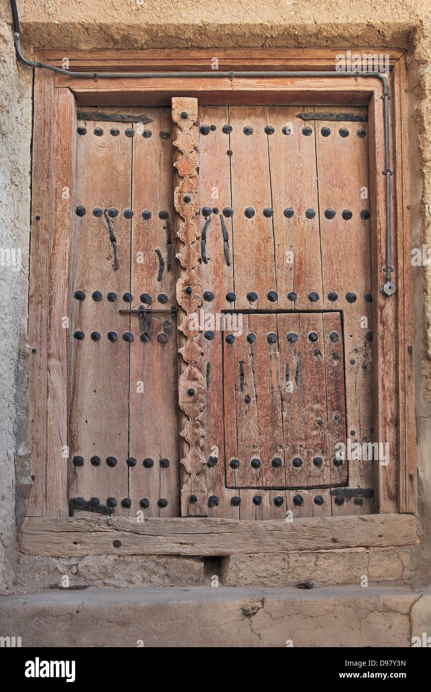 Old wooden door in the Matrah fort, Muscat, Oman Stock Photo