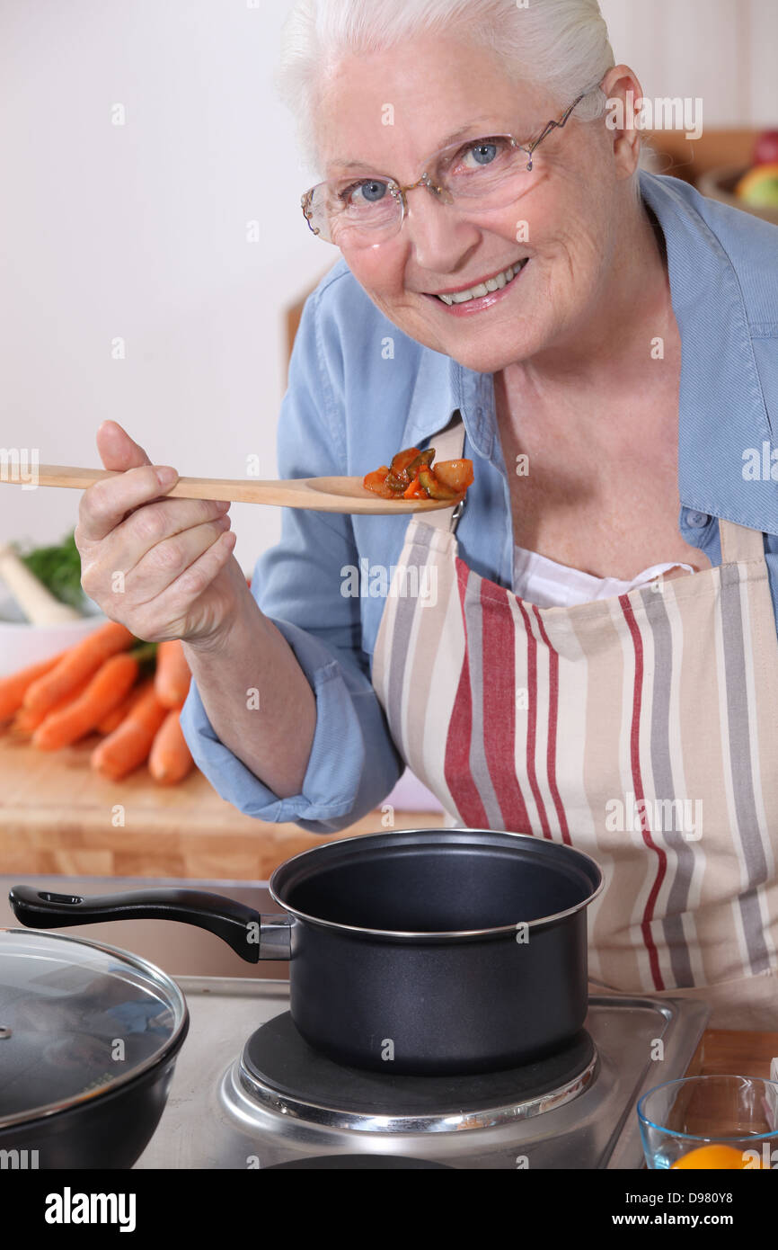 An old lady cooking Stock Photo - Alamy