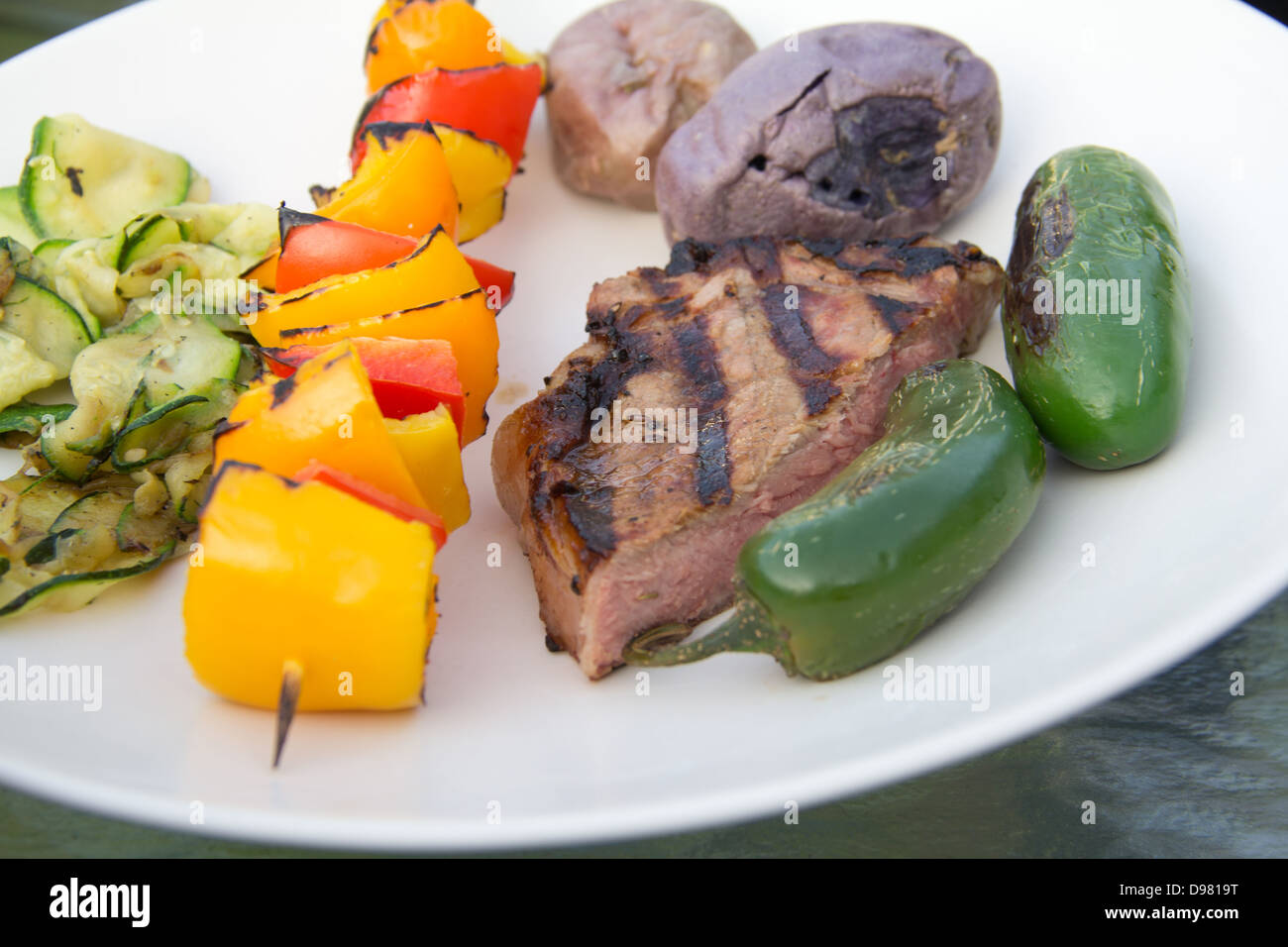 Kabob and steak with vegetables Stock Photo