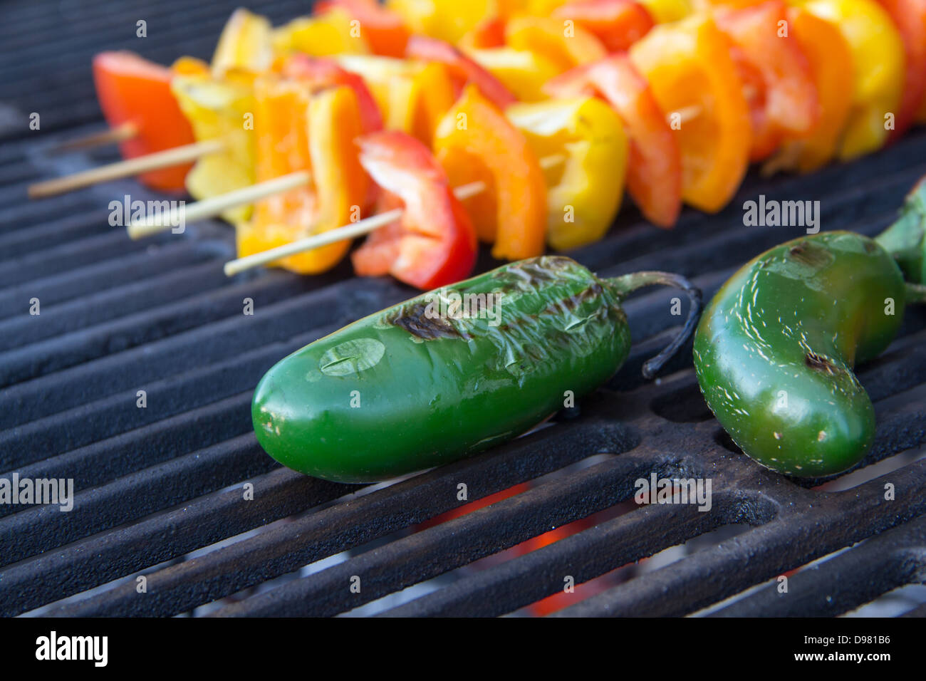 Grilled jalapeños on a grill Stock Photo