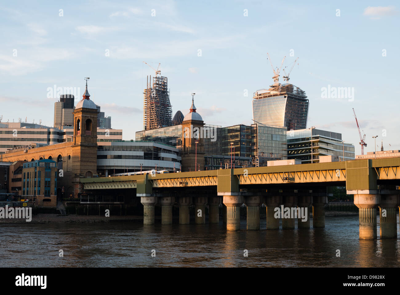 LONDON, UK - London Bridge in the foreground, with new highrises being constructed in the City of London in the background. Stock Photo
