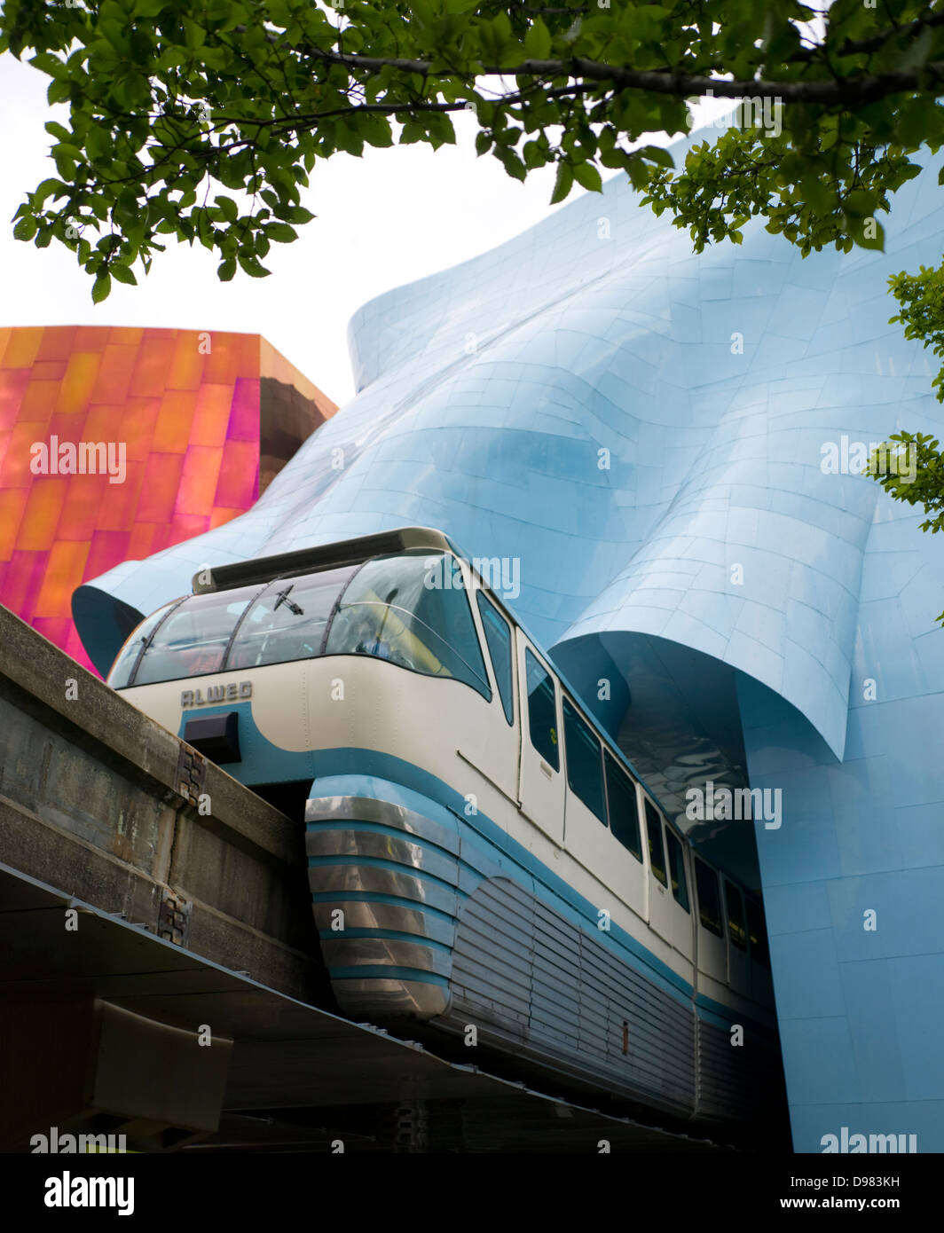 A train passes overhead via elevated rail downtown arriving at the Seattle Center Stock Photo