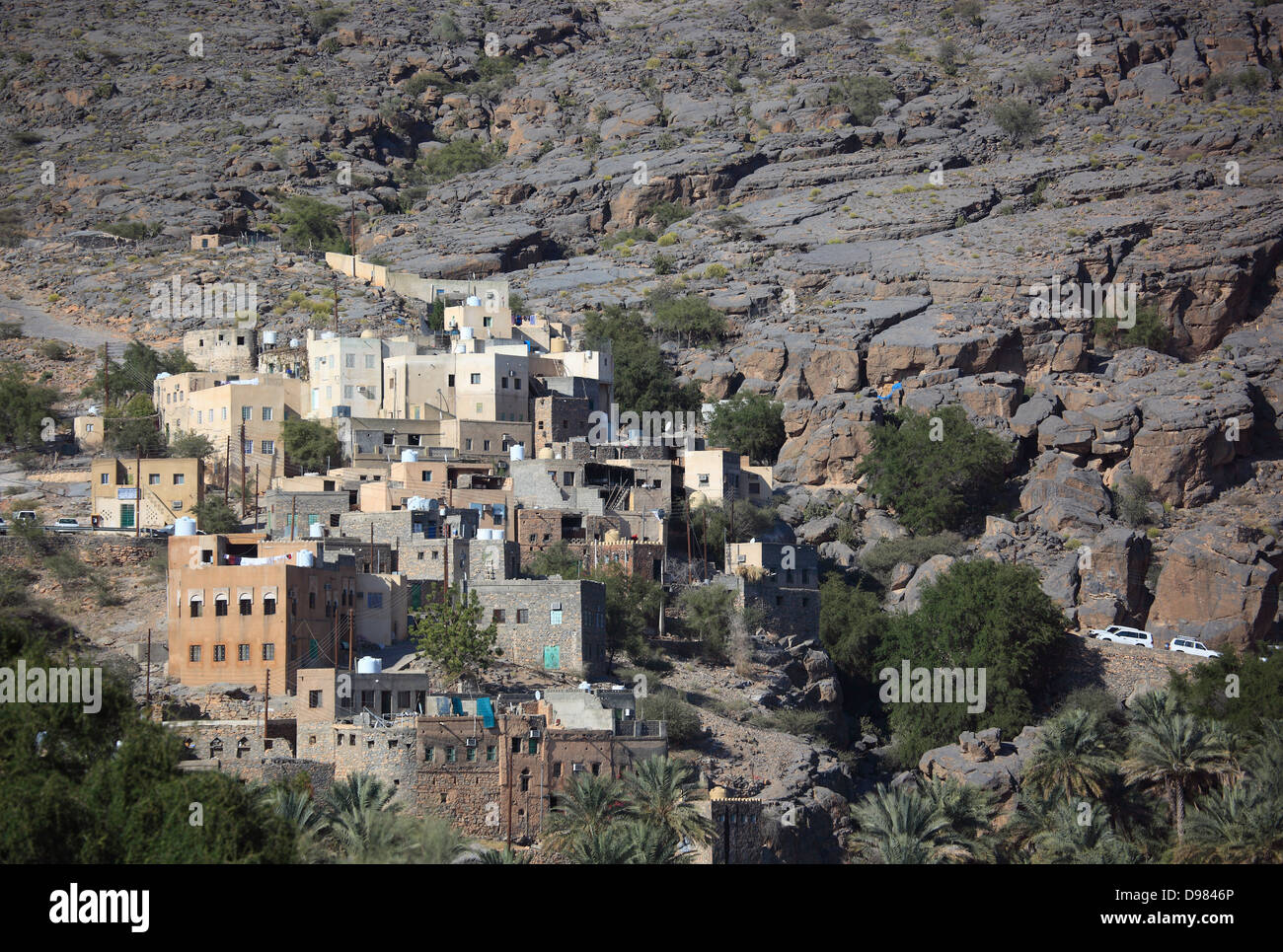 Al-Hamra is one of many interesting oases with an old mucky part with red houses on stone foundations. Here the district of Misf Stock Photo