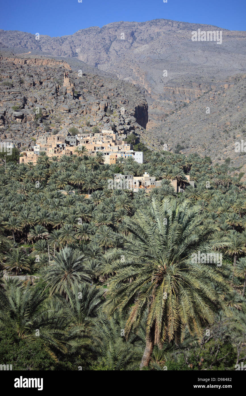 Al-Hamra is one of many interesting oases with an old mucky part with red houses on stone foundations. Here the district of Misf Stock Photo