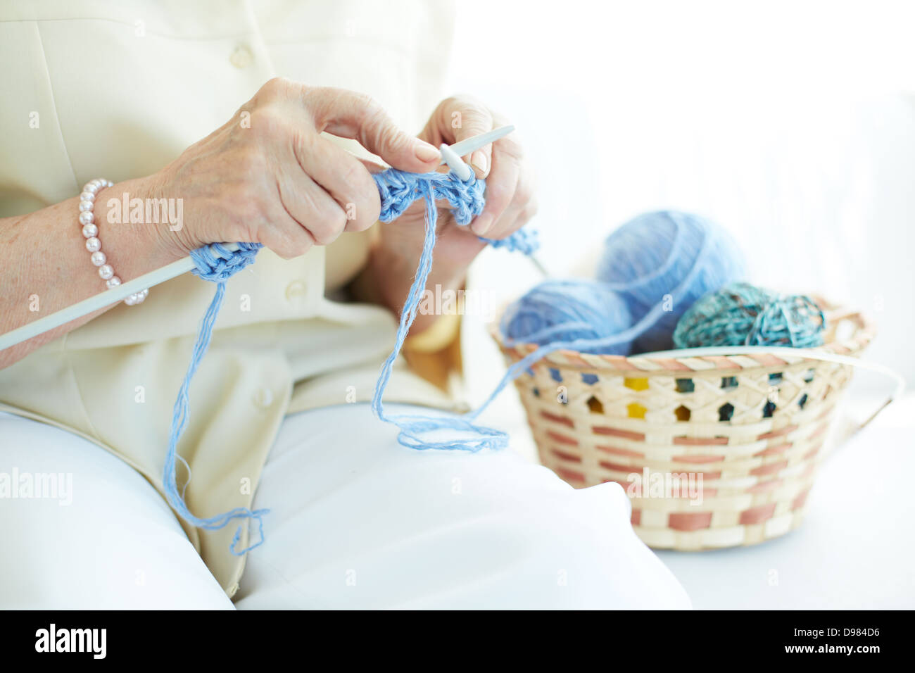 Hands of elderly woman knitting woolen clothes Stock Photo Alamy