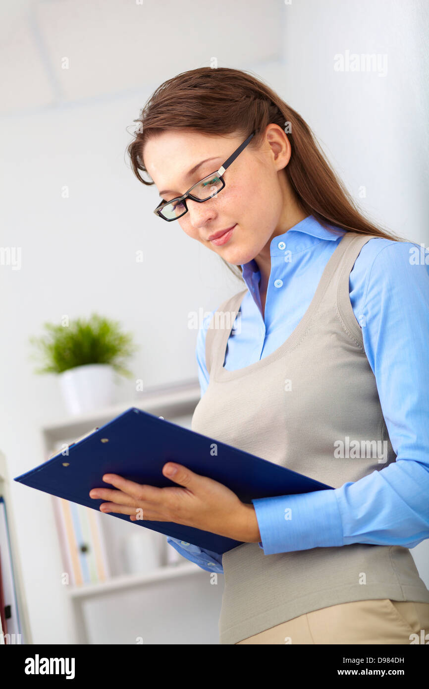 Portrait of elegant secretary making notes in office Stock Photo - Alamy