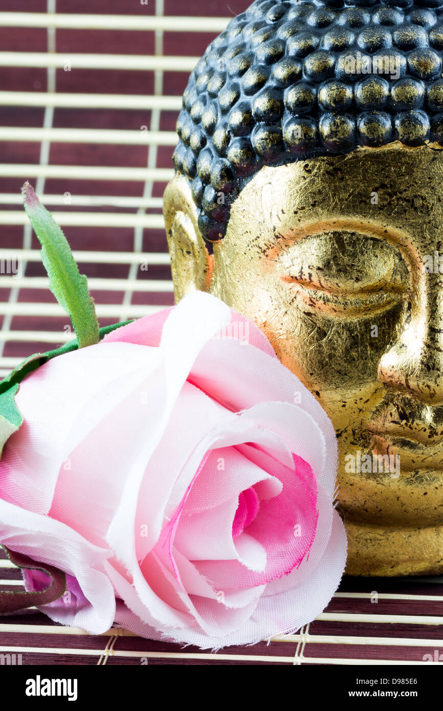 Flower and Buddah Head Stock Photo