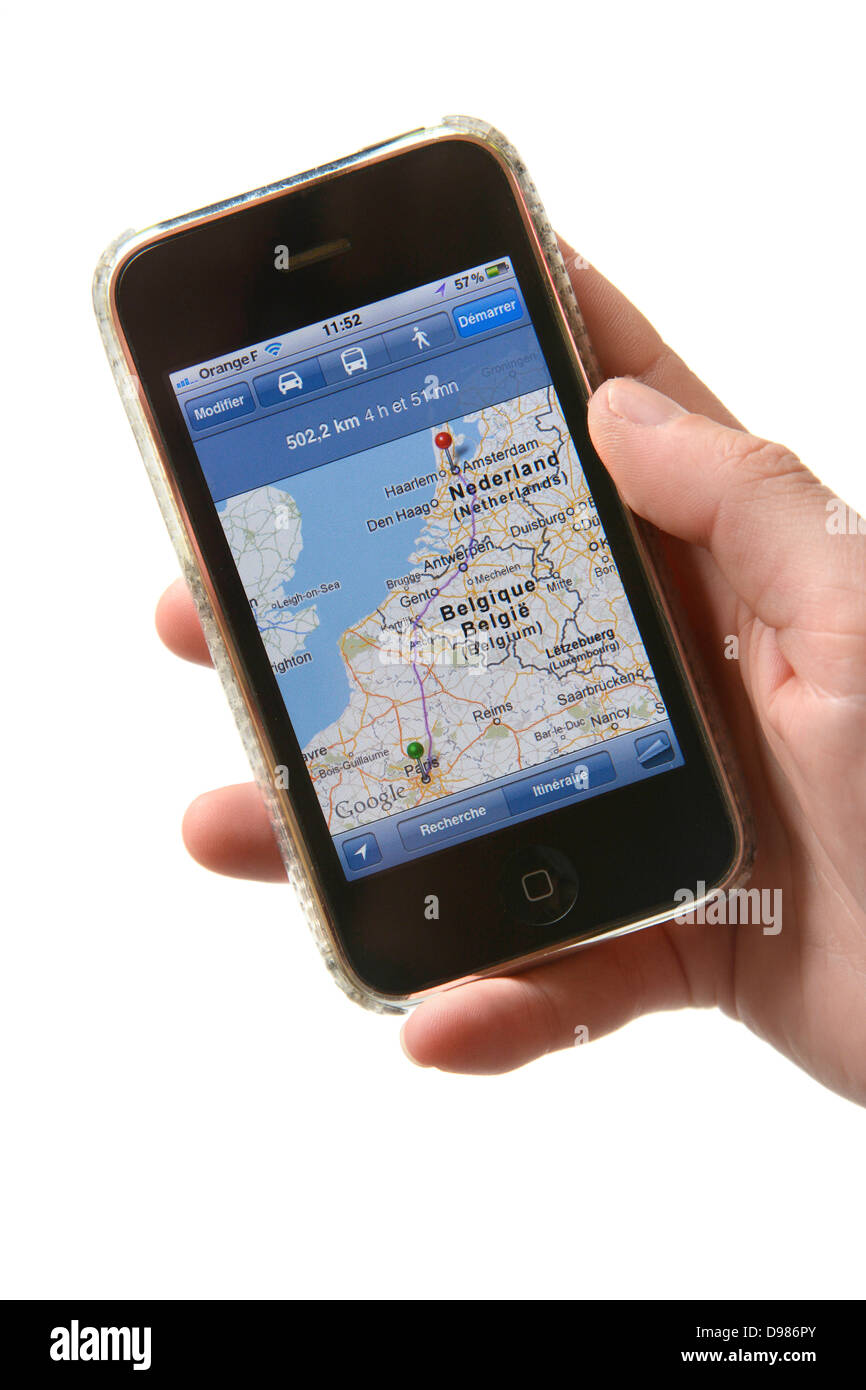 Woman hand holding iPhone showing navigation on google maps Stock Photo