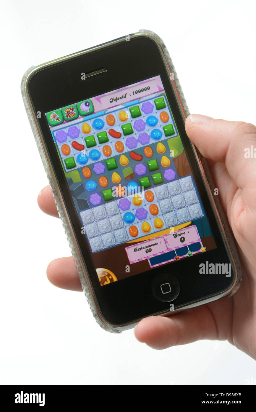 Playing a game on a mobile phone Stock Photo