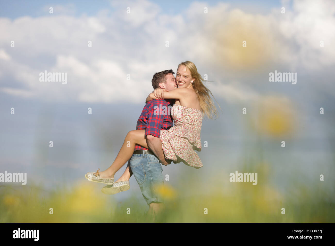 a young couple in a beautiful landscape Stock Photo