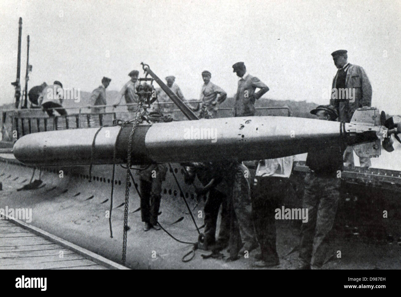 Shipping a torpedo on board the French submarine 'Xiphia'. Stock Photo