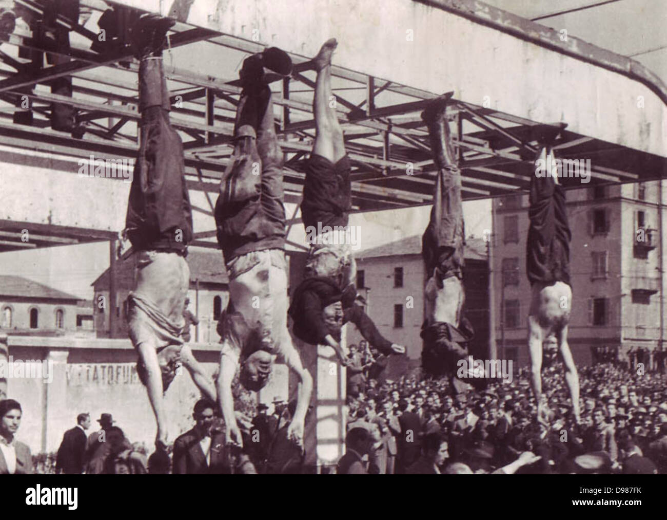 Benito Mussolini (1883-1945) and his mistress Clara Petacci hanging in a public square after their execution by Italian Communist partisans in April 1945. Stock Photo