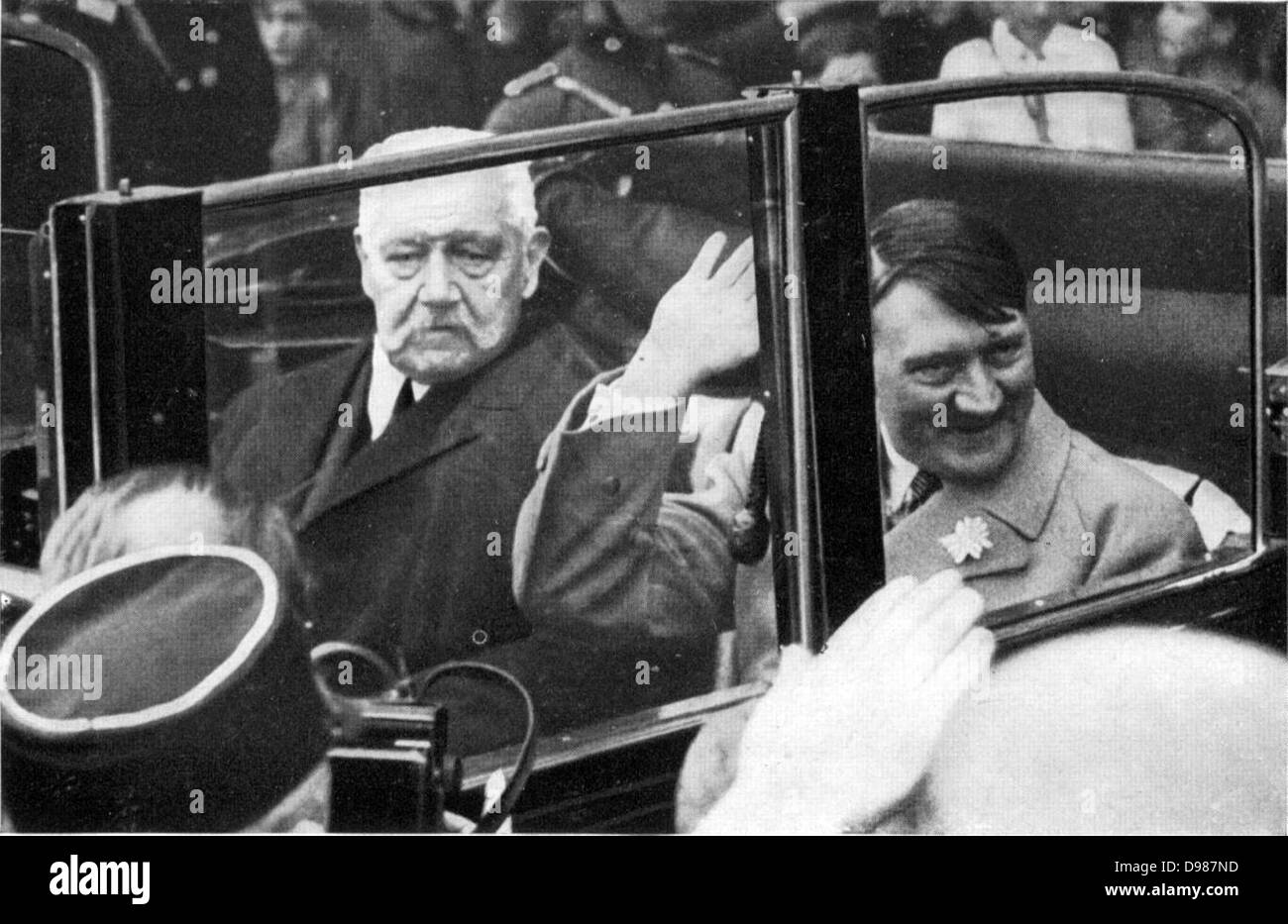 President Hindenberg rides with Adoph Hitler after the latter's appointment as Chancellor of Germany in January 1933. Stock Photo