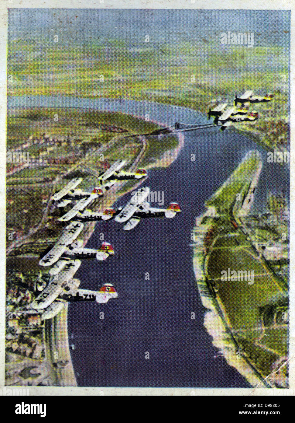 German re-armament and militarisation: A squadron of fighter planes over the Rhine. From series of 270 cigarette cards 'Die Deutsche Wehrmacht', Dresden, 1936. Stock Photo