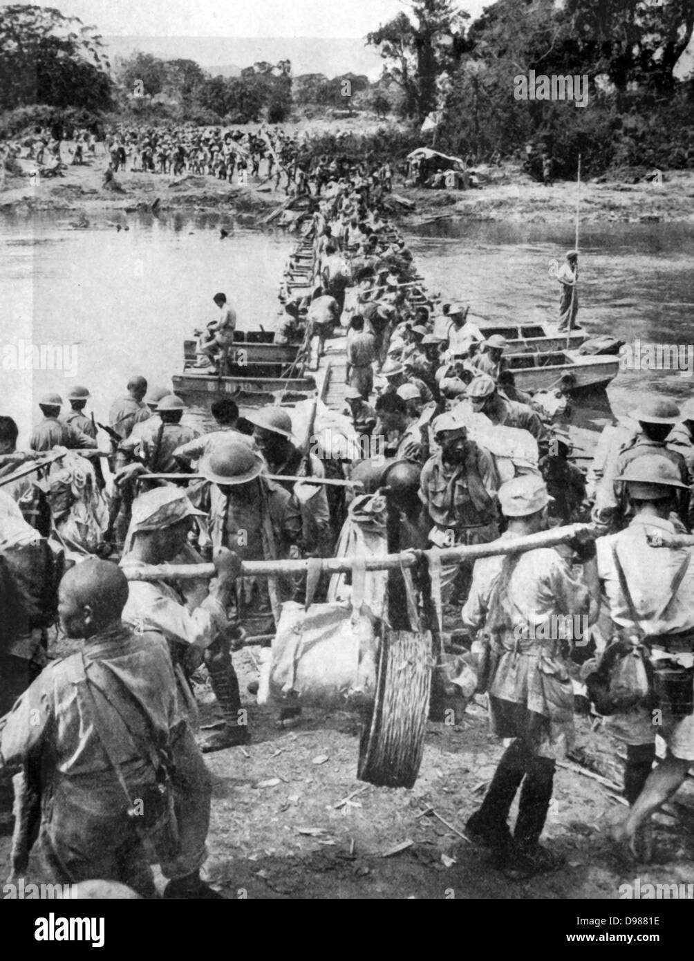 Allied Troops cross the Mogaung river in Burma, capturing Shaduzup, on March 24th. Stock Photo