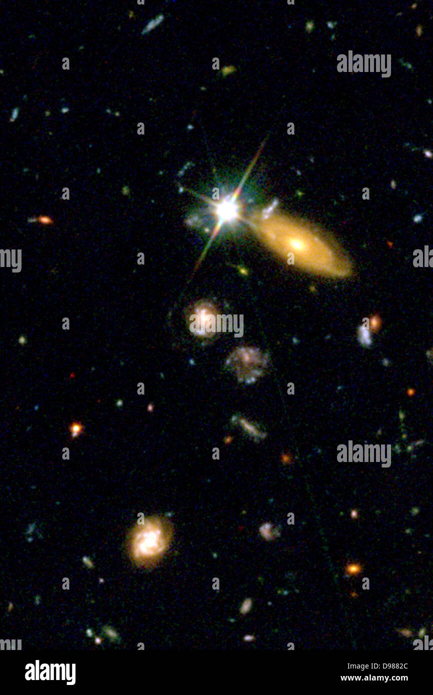 Supernova (SN 2002dd) in the Hubble Deep Field, April 10, 2003. Hubble Space Telescope observations of a pair of very distant exploding stars, called Type Ia supernovae, provide new clues about the accelerating universe and its mysterious 'dark energy.' Astronomers used the telescope's Advanced Camera for Surveys to help pinpoint the supernovae, which are approximately 5 billion and 8 billion light-years from Earth. The farther one exploded so long ago the universe may still have been decelerating under its own gravity. Stock Photo