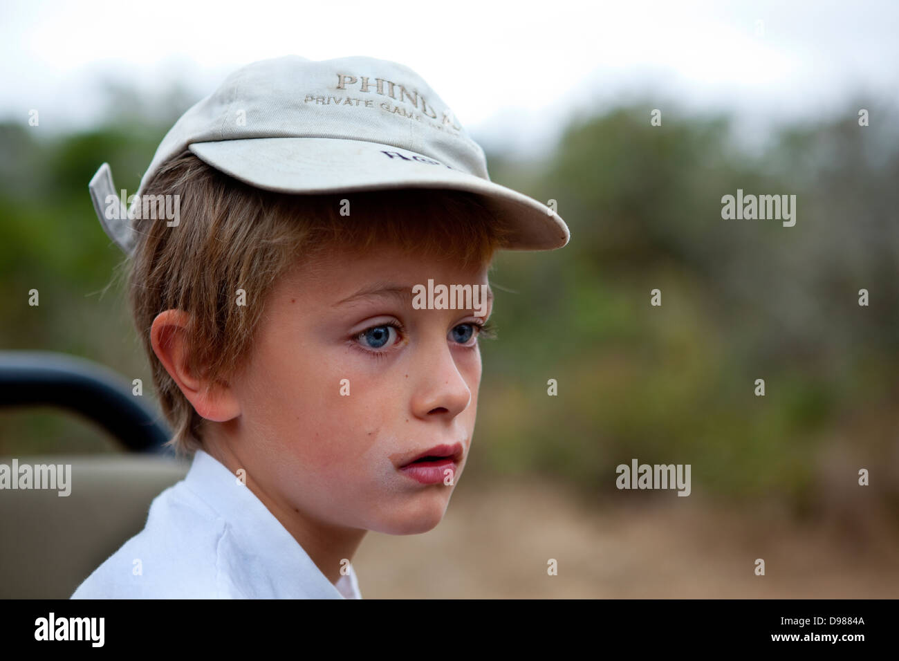 Boy on safari Phinda Game Reserve, South Africa Stock Photo