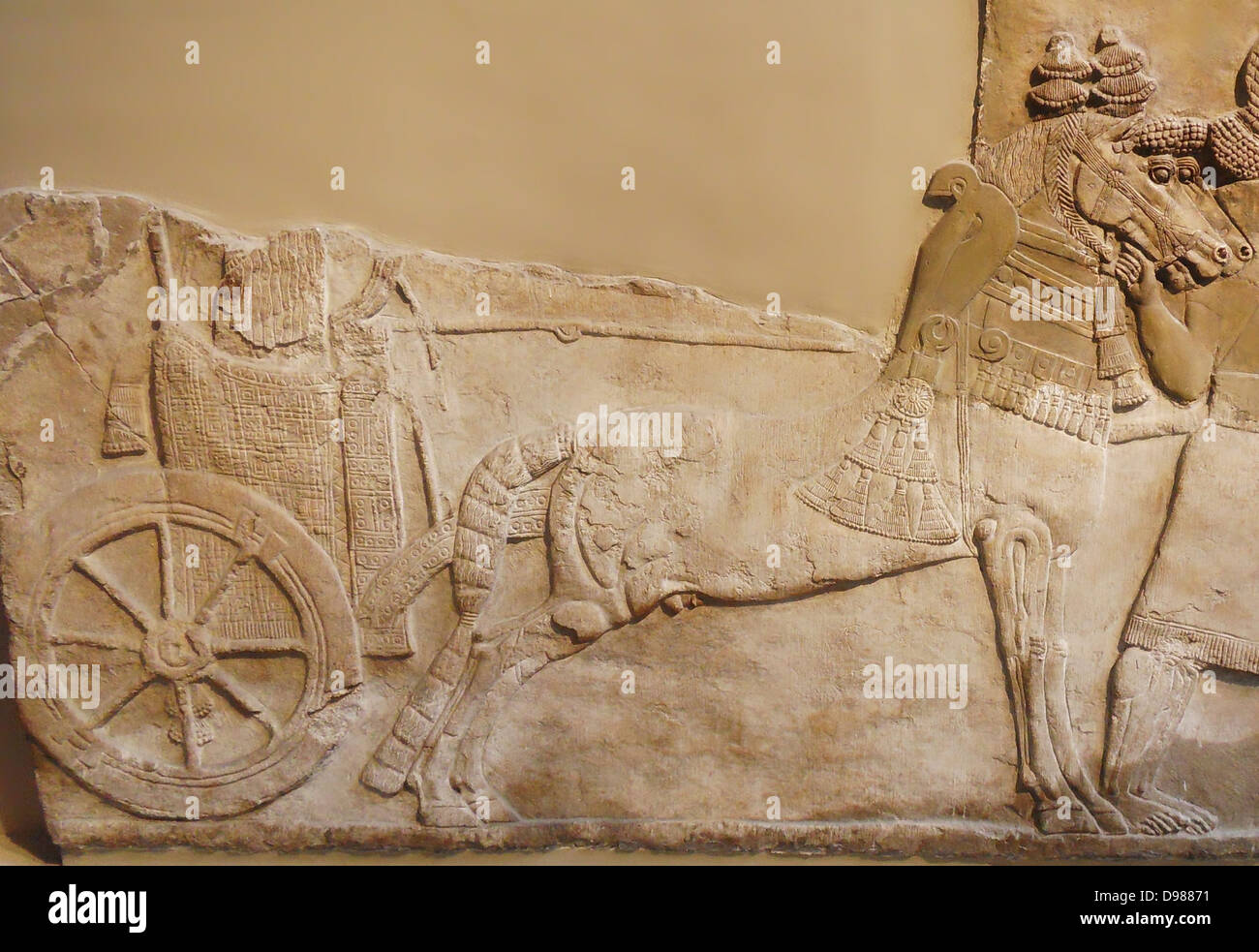 Chariot with wheel depicted in a stomne relief from Nimrud (ancient Kalhu), northern Iraq. Neo-Assyrian, about 730-727 BC Stock Photo