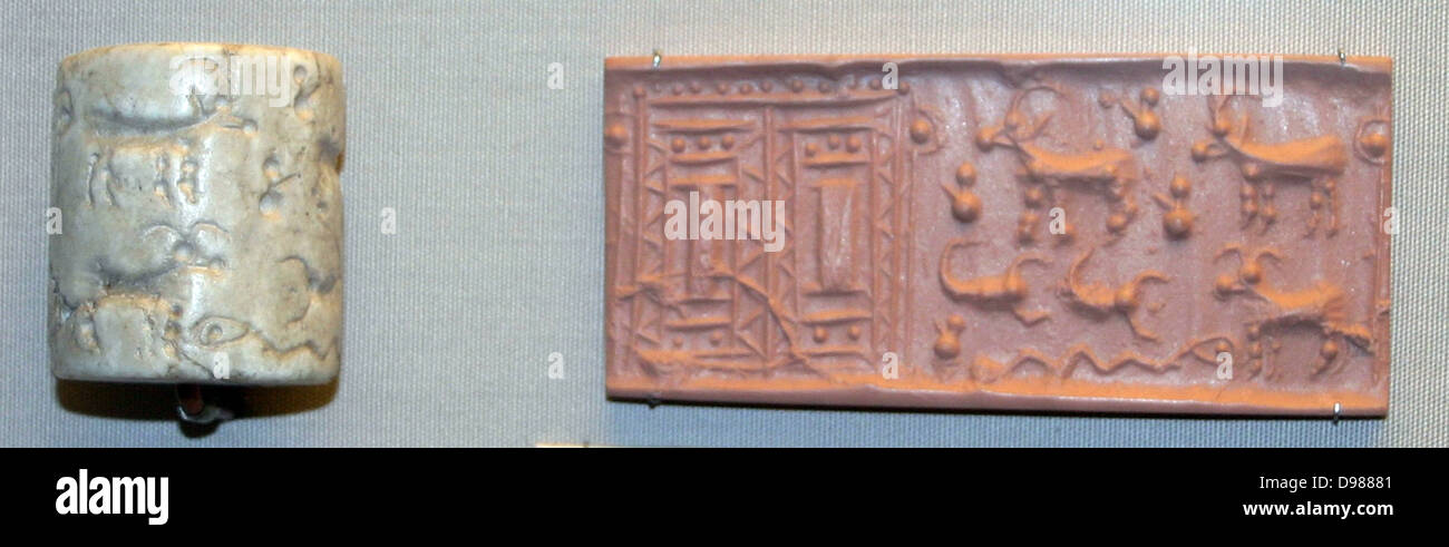 Assyrian cylinder seal from a grave. It depicts two pillars, a goat, a scorpion and serpent. A cylinder seal is a cylinder engraved with a 'picture story', used in ancient times to roll an impression onto a two-dimensional surface, generally wet clay, c2700 BC. Stock Photo