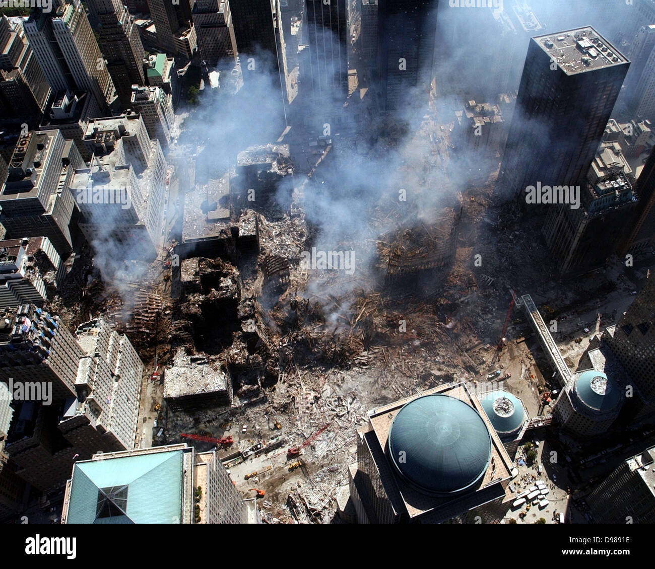 Ground Zero, New York City, N.Y. (Sept. 17, 2001) -- An aerial view shows only a small portion of the crime scene where the World Trade Center collapsed following the Sept. 11 terrorist attack. Surrounding buildings were heavily damaged by the debris and massive force of the falling twin towers. Clean-up efforts are expected to continue for months. U.S. Navy photo Stock Photo
