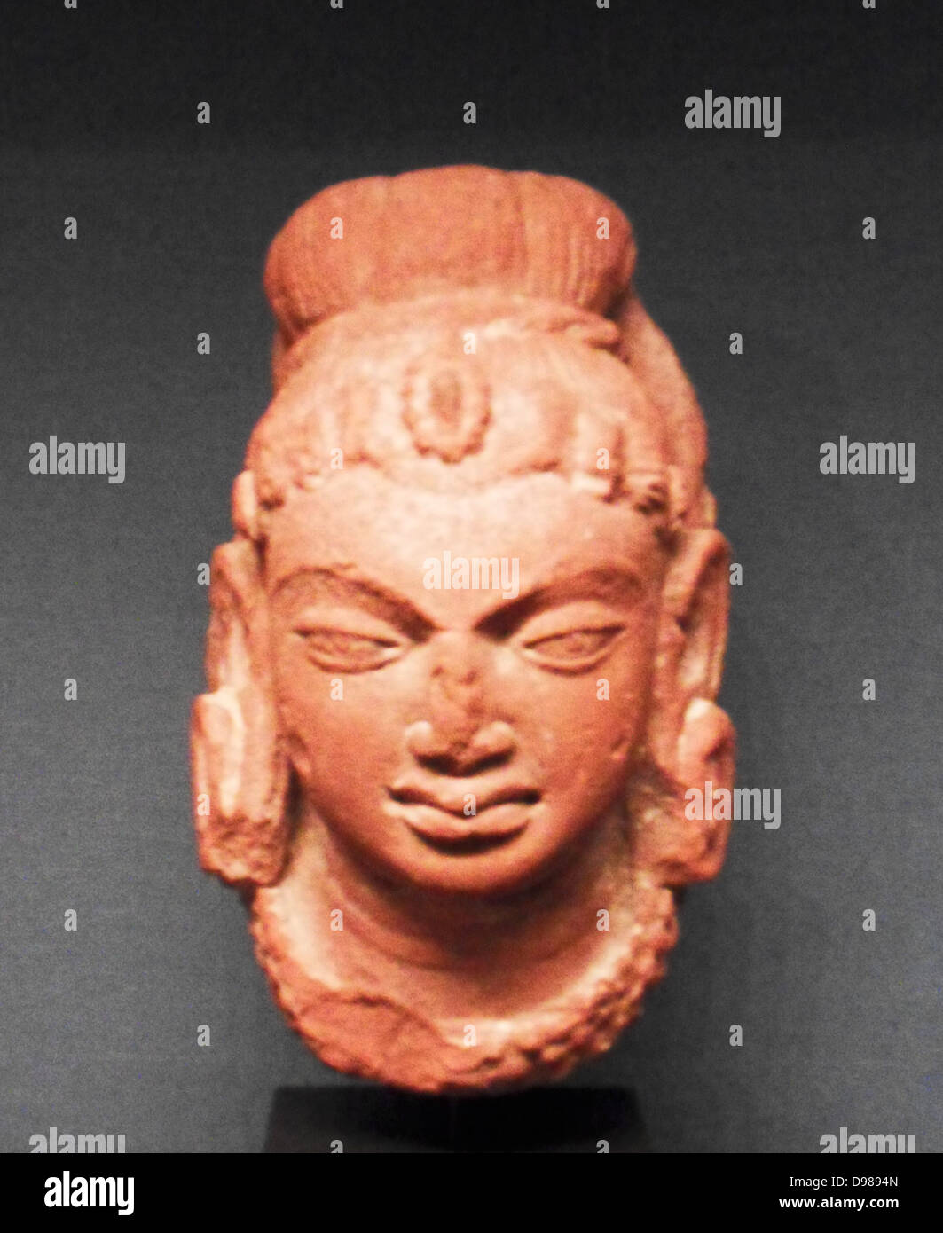 Head of Shiva, north India, AD 400-500.  Terracotta.  This strongly  modelled head shows the god with the matted locks of an ascetic and the third eye of insight. Stock Photo