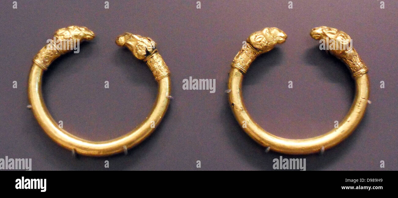 Bracelets, bronze, but encased in gold; Rams head terminals Stock Photo